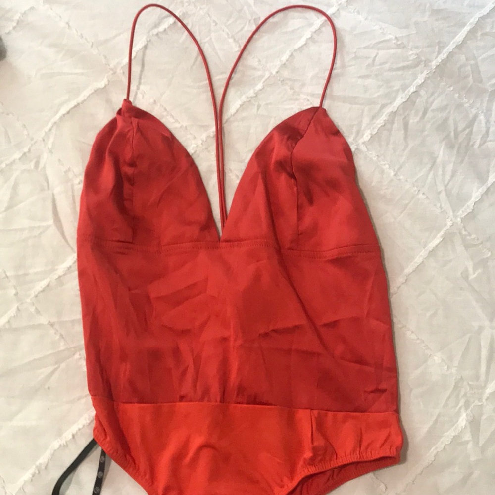 Orange body suit